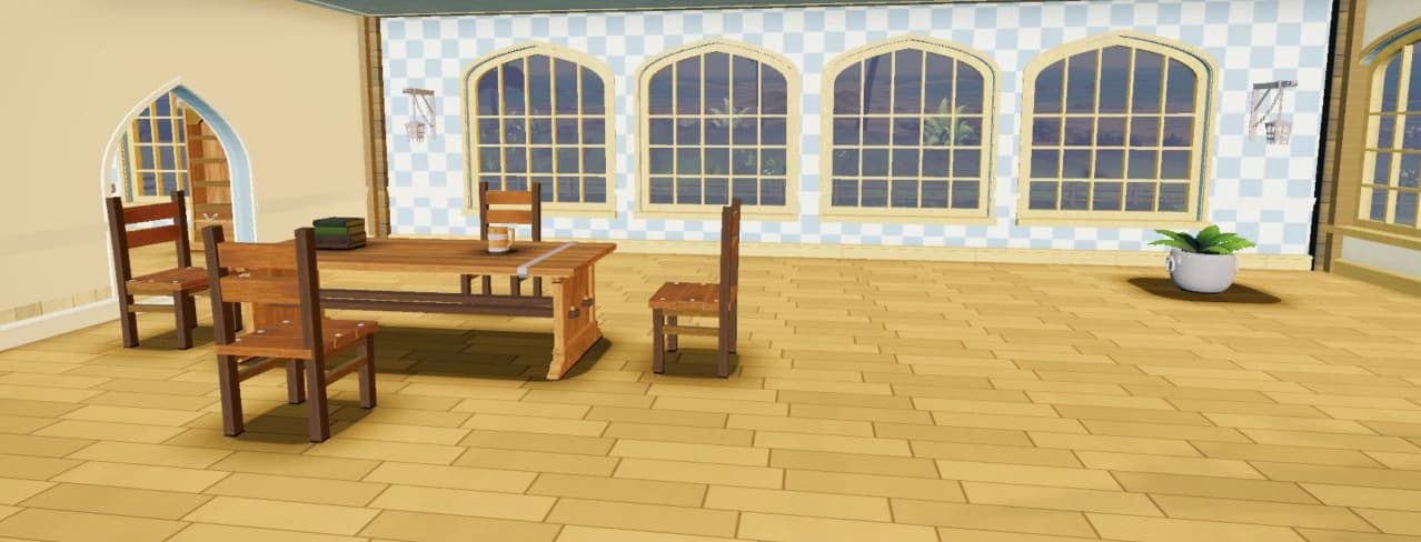 Actual Seaglass Clubhouse interior with a shared wooden table, chairs, and tall arched windows